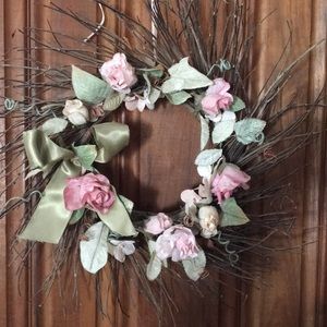 Delicate beribboned rose bud and twig wreath.